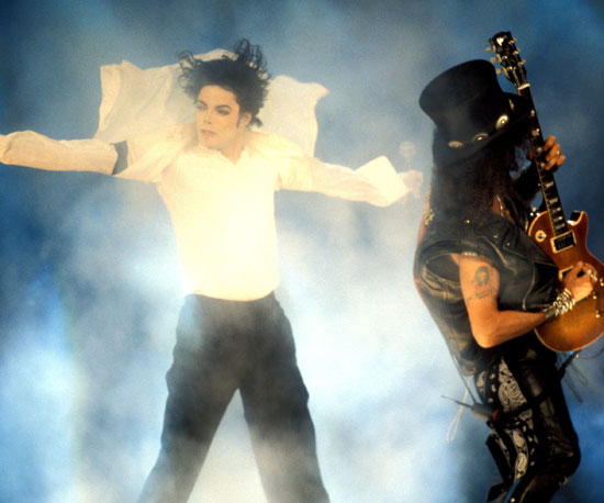 Slash played the guitar while Michael Jackson sang "Black or White" in 1995.
Slash played the guitar while Michael Jackson sang "Black or White" in 1995.