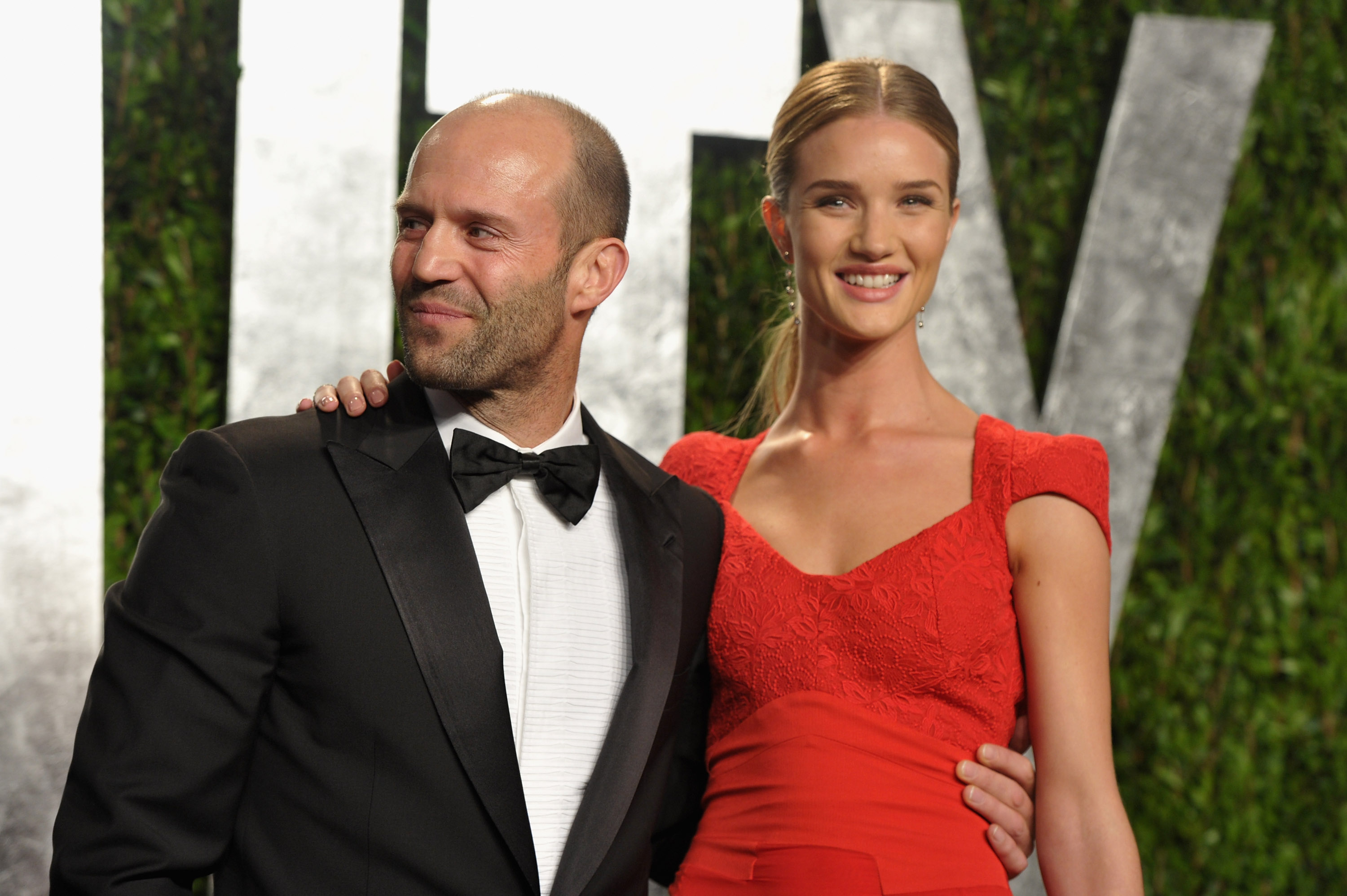 Jason Statham and girlfriend Rosie Huntington-Whiteley at the Vanity Fair afterparty. Jason Statham and girlfriend Rosie Huntington-Whiteley at the Vanity Fair afterparty.