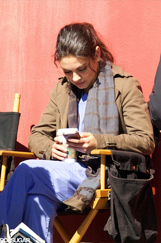 Mila Kunis took a coffee break and checked her phone while filming