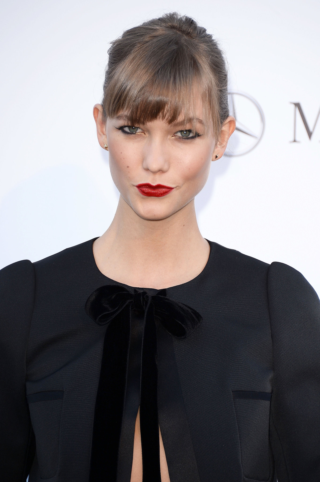 Karlie Kloss wore her famous bob pulled back with her bangs dusting