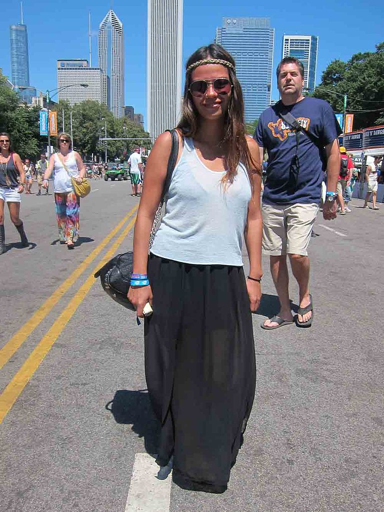 Viridiana's breezy ensemble — a loose white tank over a sheer black maxi shirt — was a nice antidote to the festivity's '90s revival of acid-washed denim cutoffs.
Viridiana's breezy ensemble — a loose white tank over a sheer black maxi shirt — was a nice antidote to the festivity's '90s revival of acid-washed denim cutoffs.