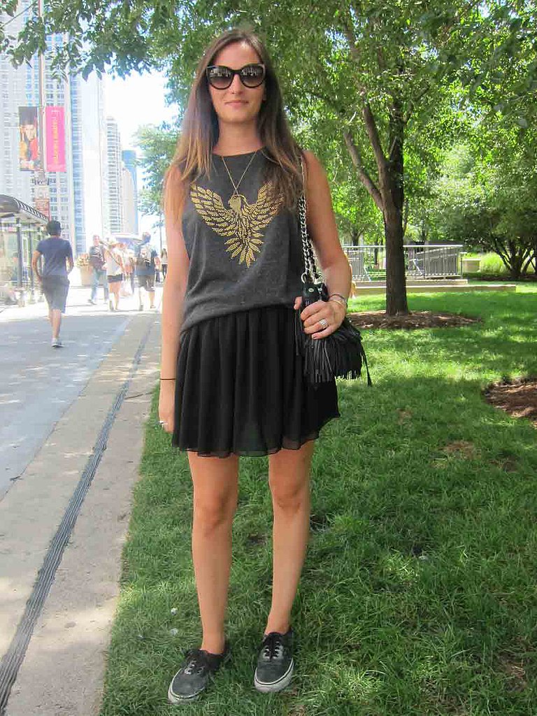 Emblem shirts were a must have this weekend. This golden eagle tank from Forever 21 served as the perfect focal point of Marine's outfit, which included an American Apparel skirt and dusty-silver Vans.
Emblem shirts were a must have this weekend. This golden eagle tank from Forever 21 served as the perfect focal point of Marine's outfit, which included an American Apparel skirt and dusty-silver Vans.