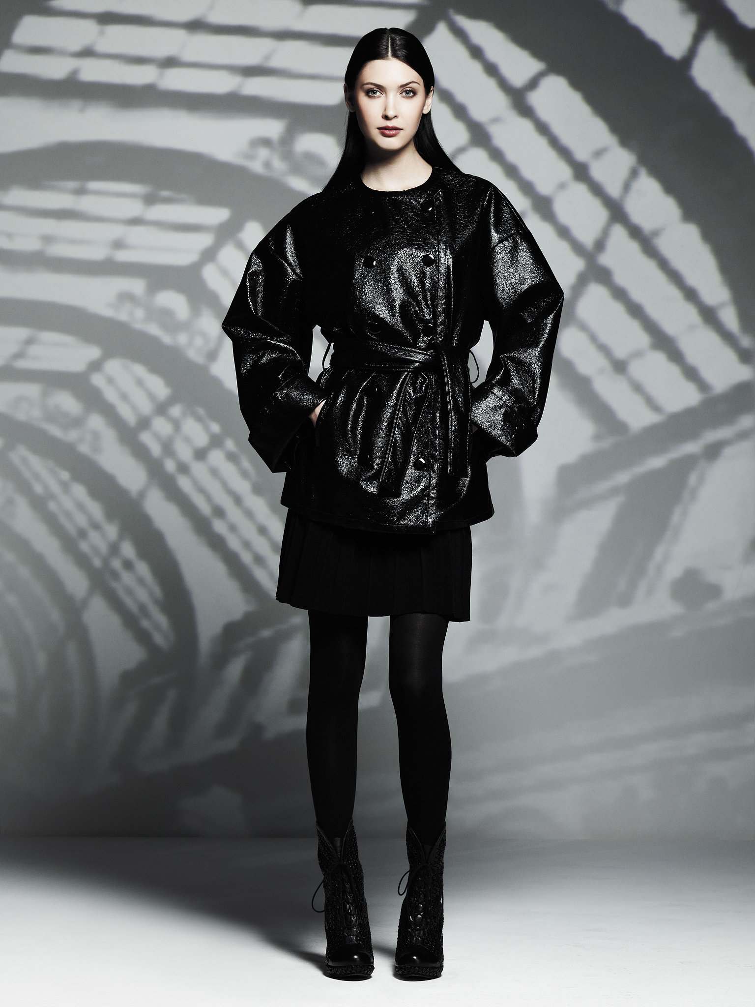 Patent Leather Trench Coat (130), Pleated Skirt (50) Photo courtesy