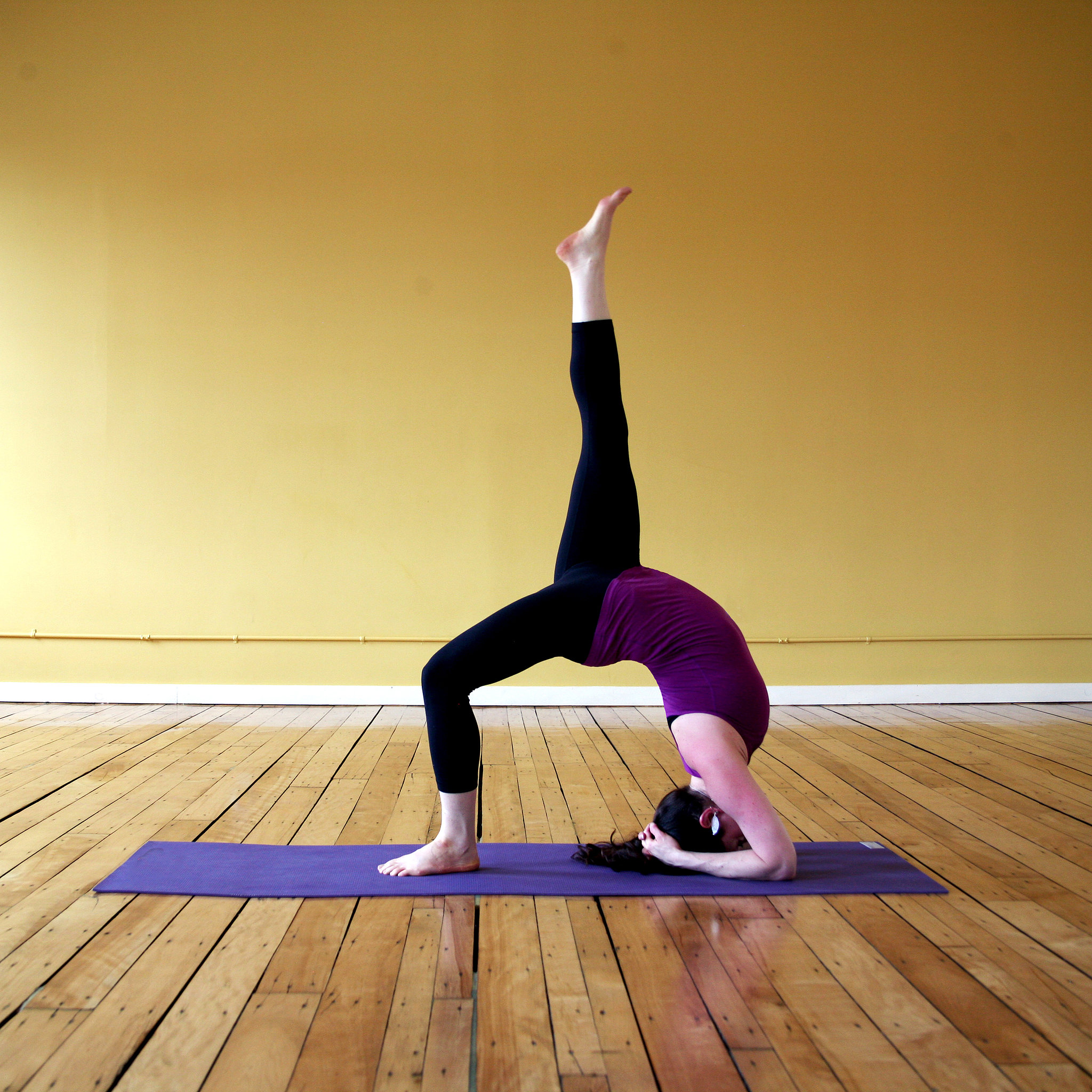 OneLegged Headstand Wheel Yoga Sequence to Diminish Your Derriere
