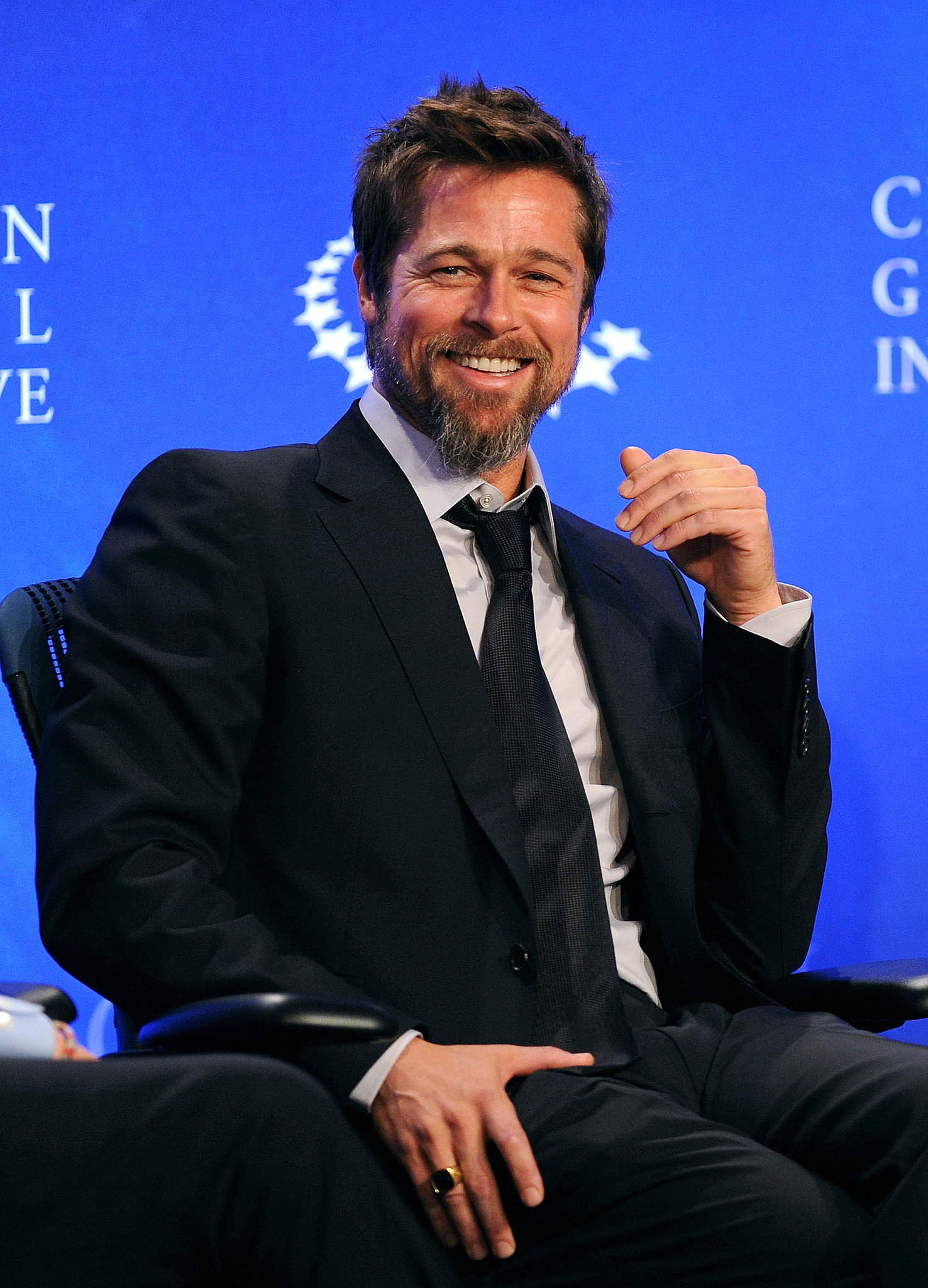 Brad seemed to catch a case of the giggles during the Clinton Global