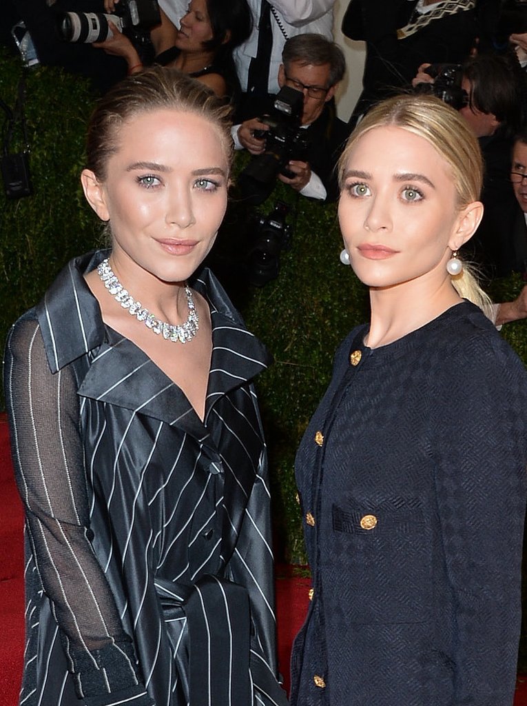 At the 2014 Met Gala, Mary Kate slicked her hair back into a loose bun while Ashley pulled hers back into a low ponytail.
At the 2014 Met Gala, Mary Kate slicked her hair back into a loose bun while Ashley pulled hers back into a low ponytail.