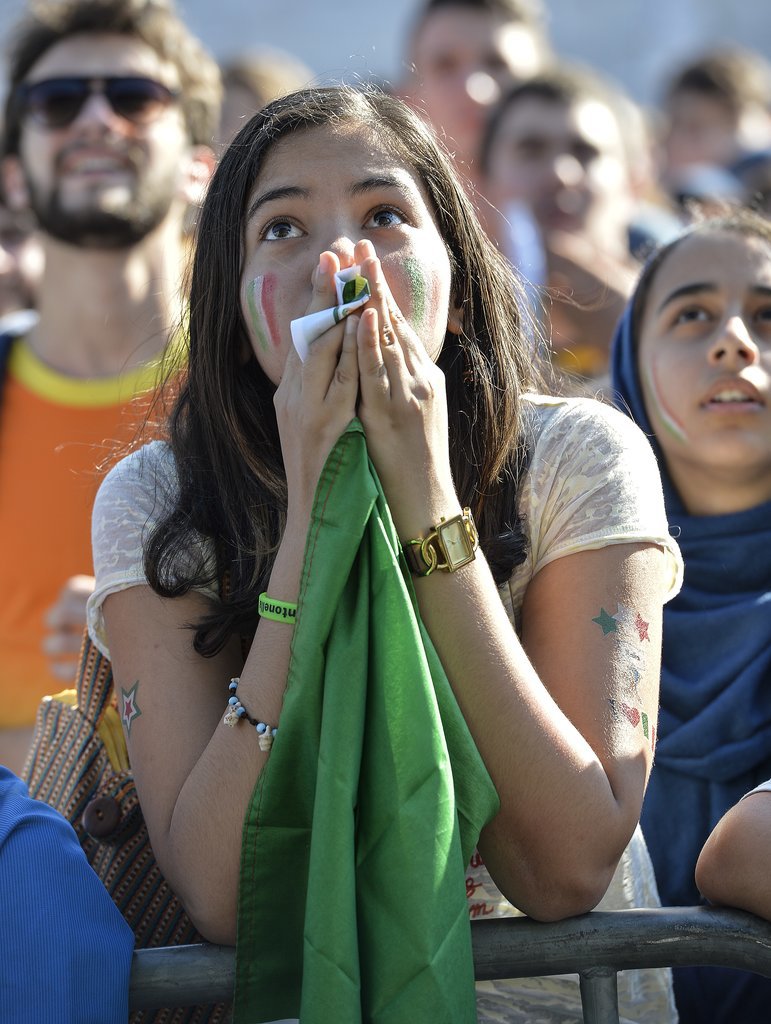 A fan of the Italian team looked anxious as she watched the game between Italy and Costa Rica.
A fan of the Italian team looked anxious as she watched the game between Italy and Costa Rica.