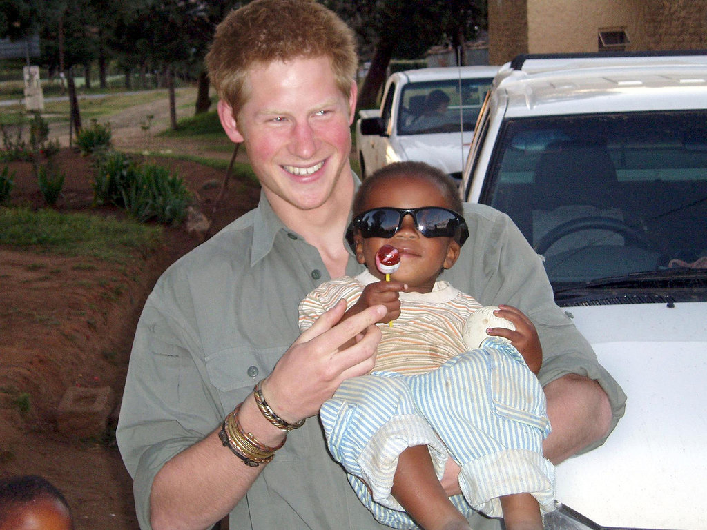 Harry got cute with a baby during a 2005 visit to Lesotho.
Harry got cute with a baby during a 2005 visit to Lesotho.