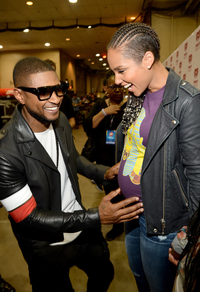 Usher couldn't help but rub Alicia Keys's growing baby bump while backstage at the iHeartRadio Festival in September 2014.
Usher couldn't help but rub Alicia Keys's growing baby bump while backstage at the iHeartRadio Festival in September 2014.