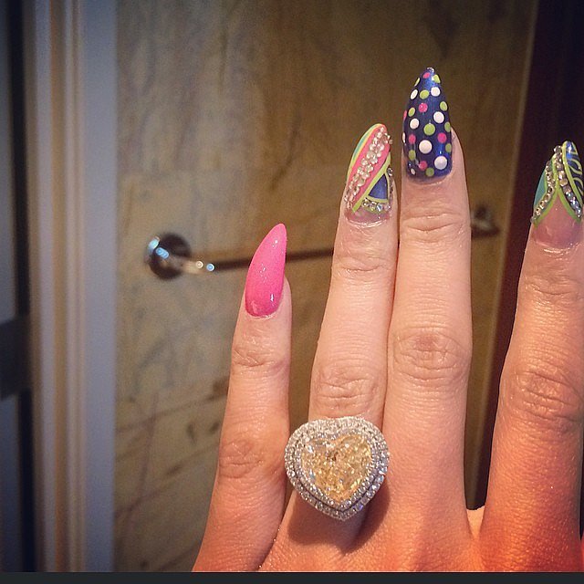 While Nicki's manicure is superfun, we can't stop staring at her maybe-engagement ring. She also posted a suspicious, emoji-filled tweet, hinting at the news.
