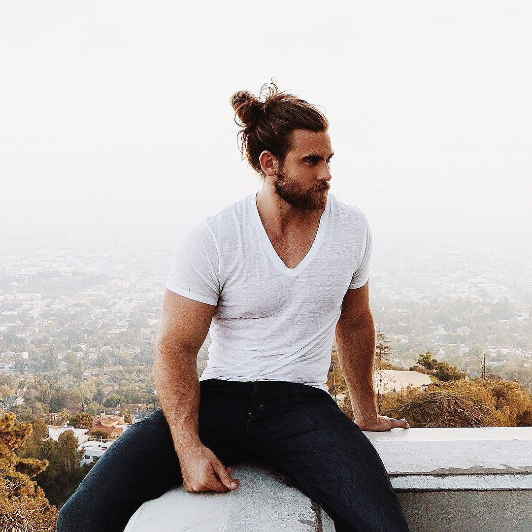 hot dude with manbun in pinstriped suit