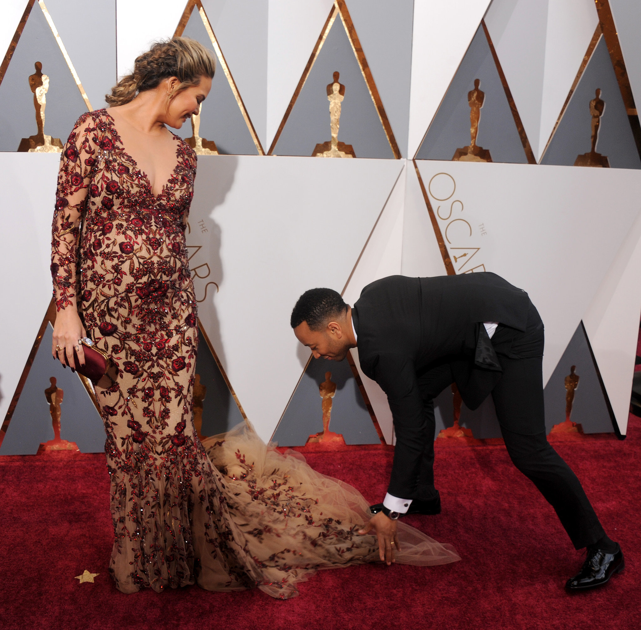 When-Chrissy-Teigen-Enlisted-John-Legend-Gown-Adjusting-Job.jpg
