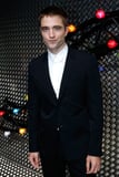 Robert Pattinson Pops Paris Mingles
