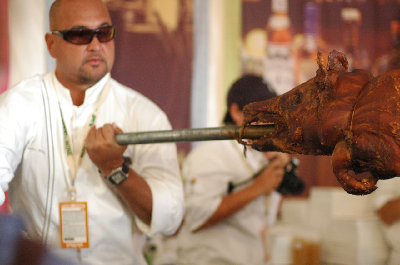 The Puerto Ricans bring in their whole roasted pig. The Puerto Ricans bring in their whole roasted pig.