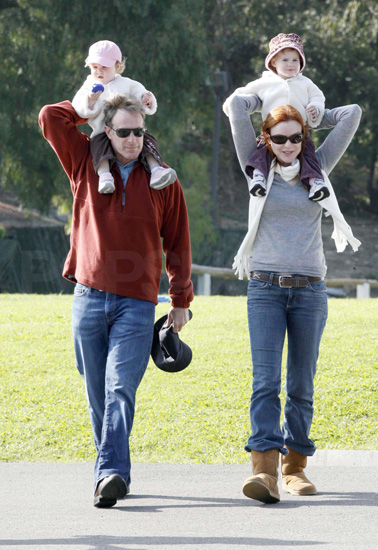Marcia Cross and her husband, Tom Mahoney took their twins, Savannah and Eden on shoulder rides through the park. Marcia Cross and her husband, Tom Mahoney took their twins, Savannah and Eden on shoulder rides through the park.